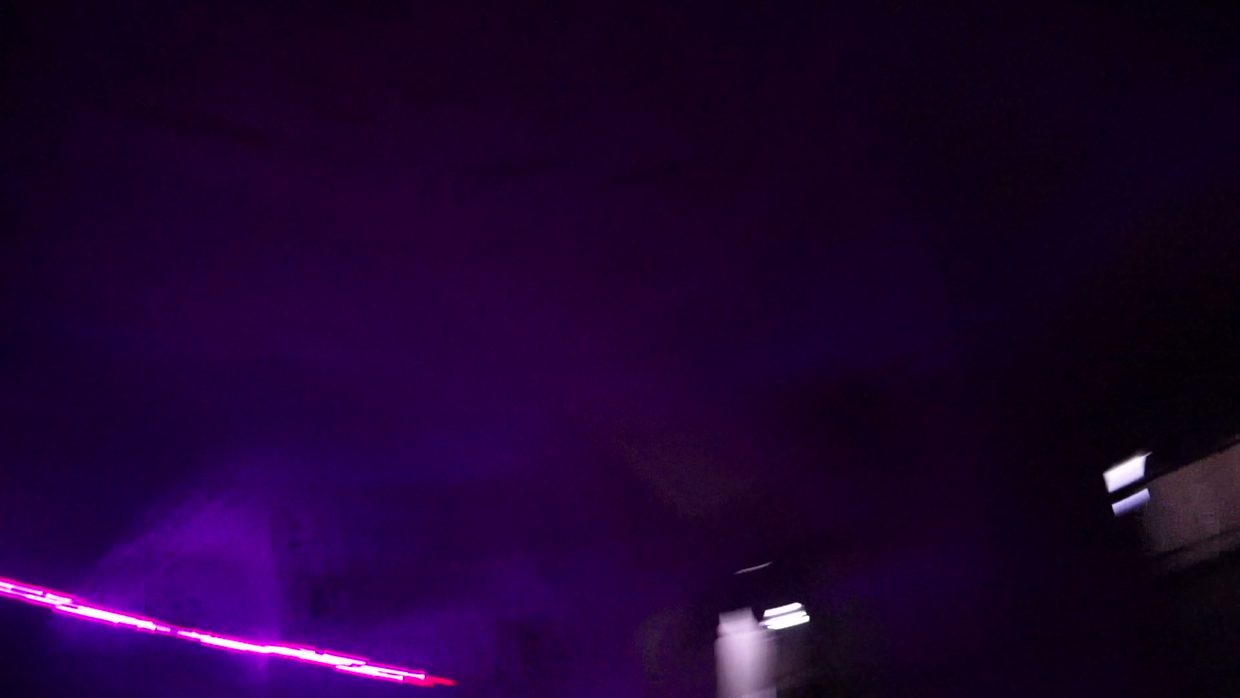 Lasers as part of one composition, synchronised with the rest of the image — not a separate attraction on the side.